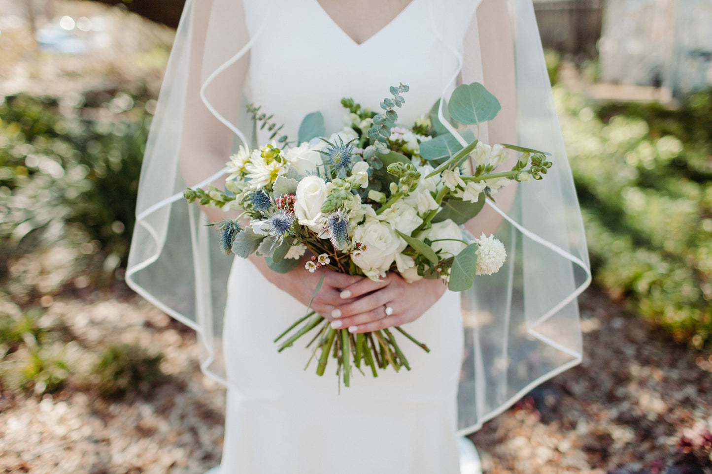 bride holding flowers