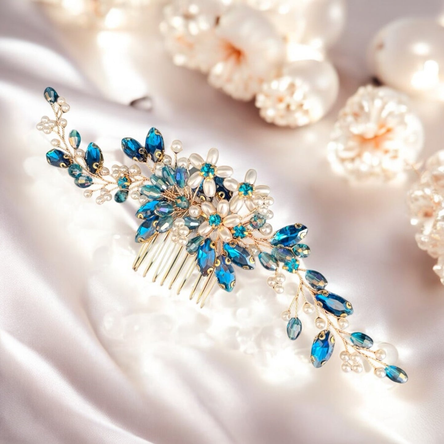 Gold bridal hair comb with peacock blue crystals and pearls on floral design