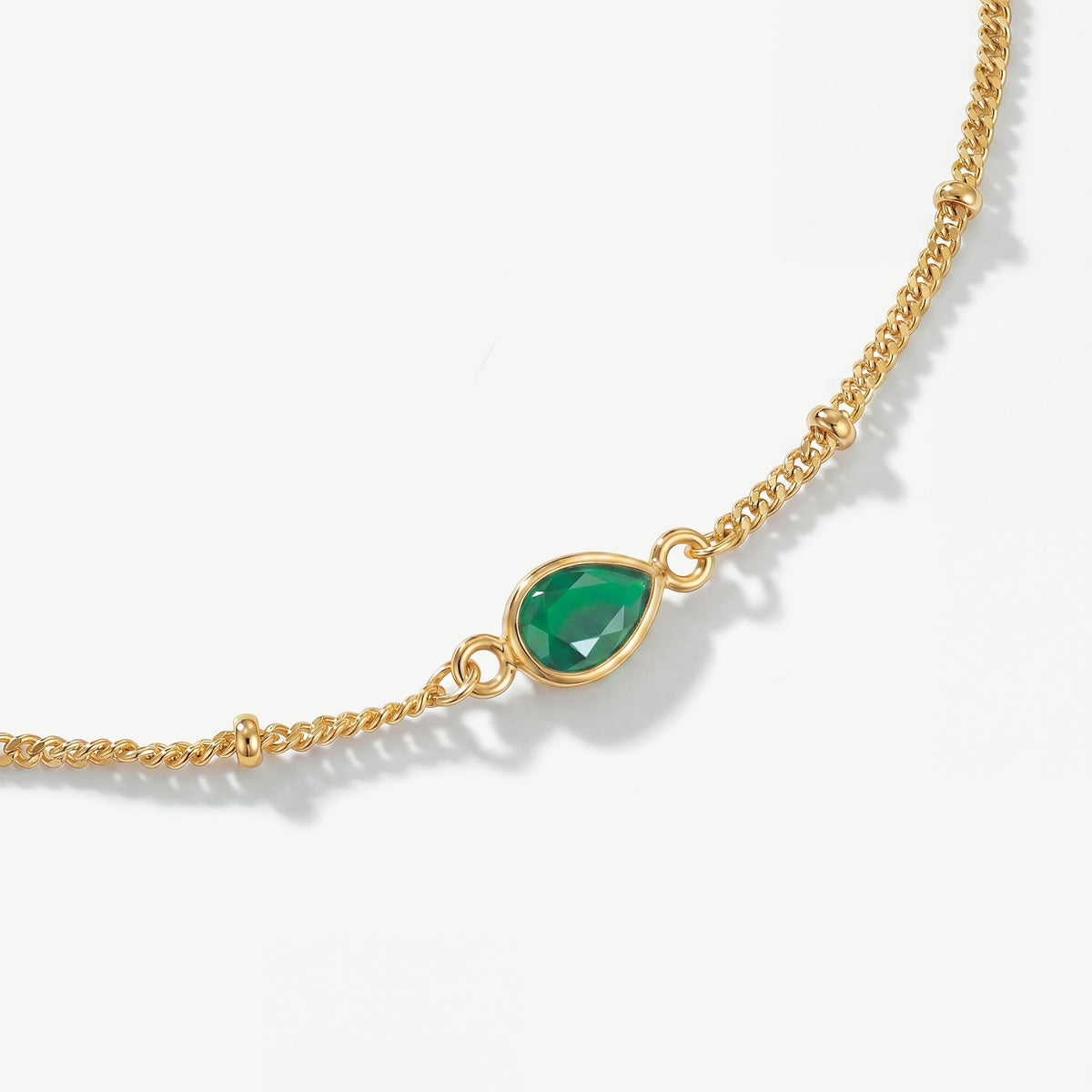 Genuine faceted green onyx teardrop gemstone on 18ct gold plated birthstone bracelet