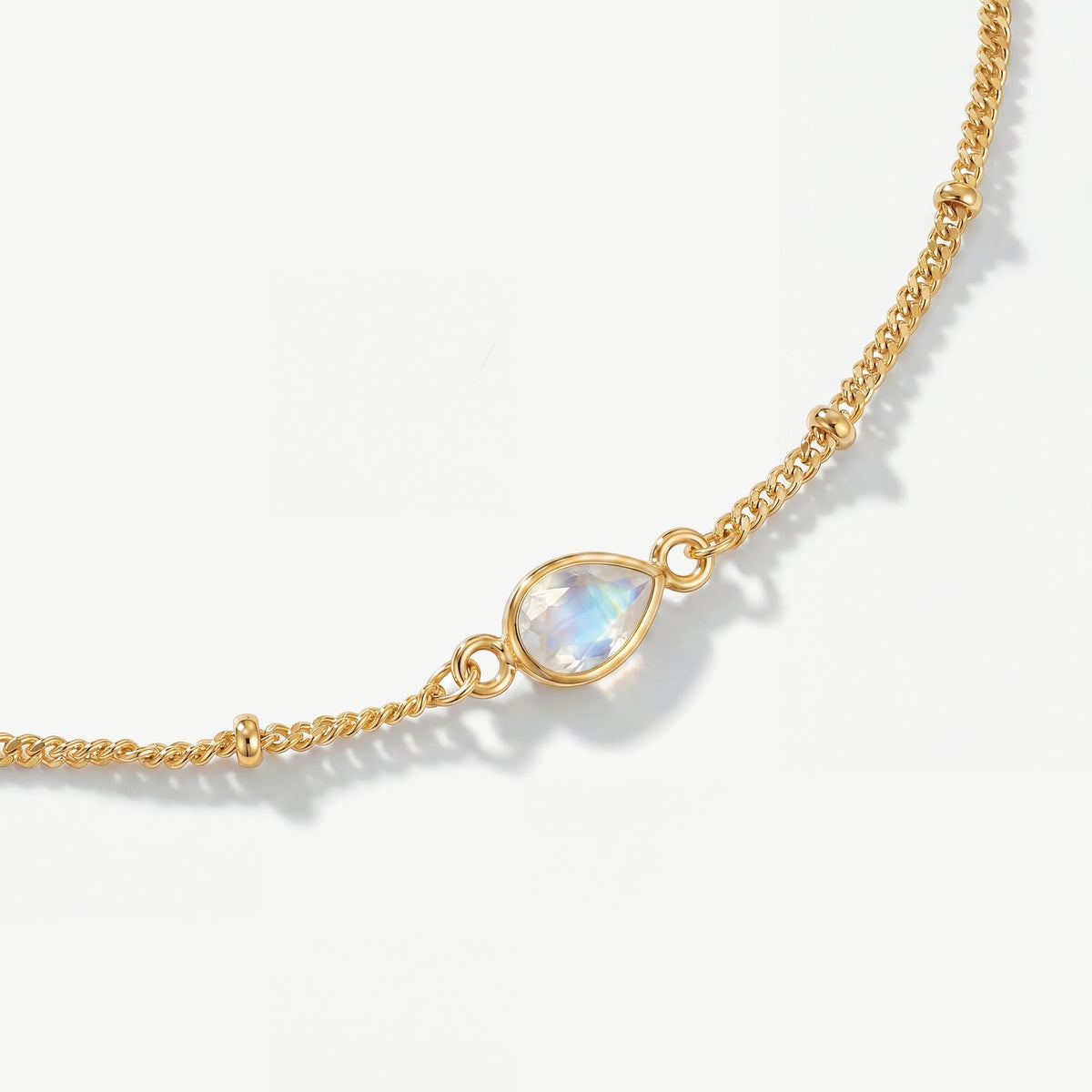 Genuine faceted rainbow moonstone teardrop gemstone on 18ct gold plated birthstone bracelet