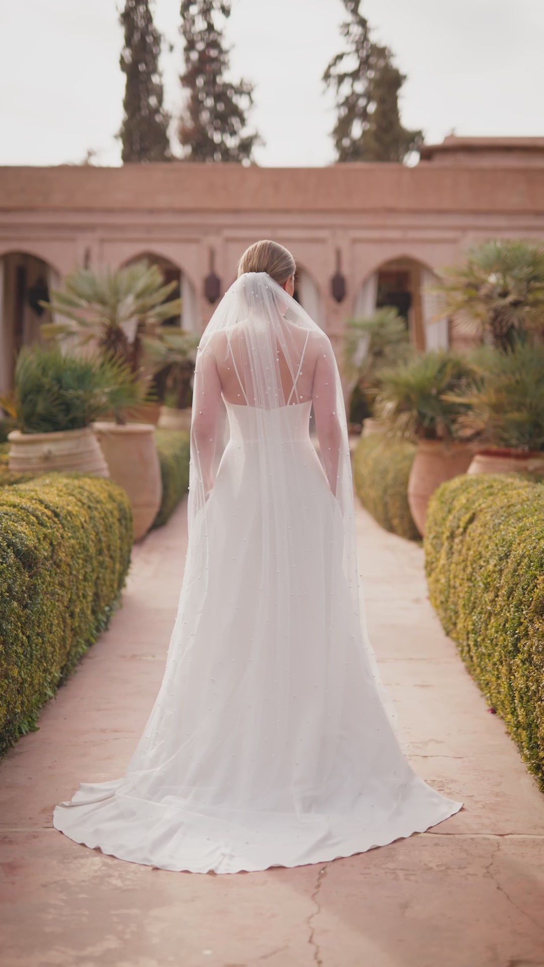 Floor length wedding veil with scattered pearls