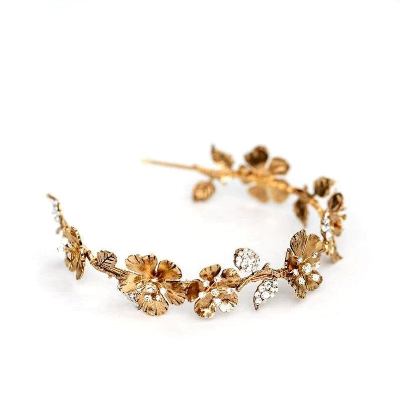 Gold floral bridal headpiece with crystal accents, elegant wedding flower crown for brides.