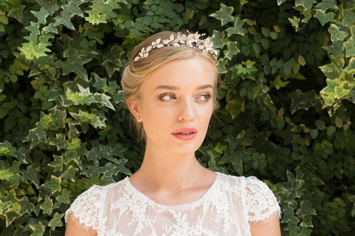 Bridal headband with delicate floral leaf design and pearl accents – elegant wedding hair accessory worn by bride
